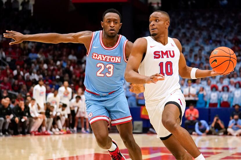 Dayton forward R.J. Blakney (23) defends as SMU guard Zach Nutall (10) looks to pass during...
