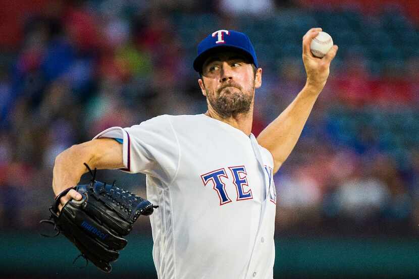 Texas Rangers starting pitcher Cole Hamels pitches during the second inning against the...