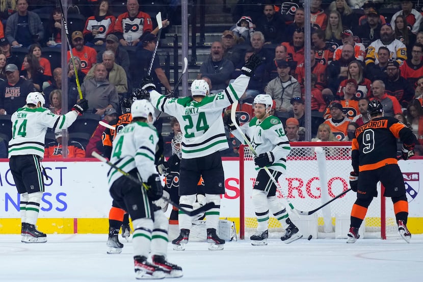 Dallas Stars' Joe Pavelski (16) celebrates with teammates after scoring a goal during the...