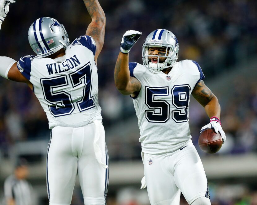 Dallas Cowboys inside linebacker Damien Wilson (57) congratulates middle linebacker Anthony...