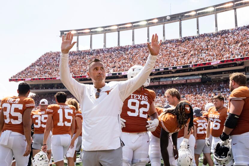 Texas head coach Steve Sarkisian waves to the fans after an NCAA college football game...