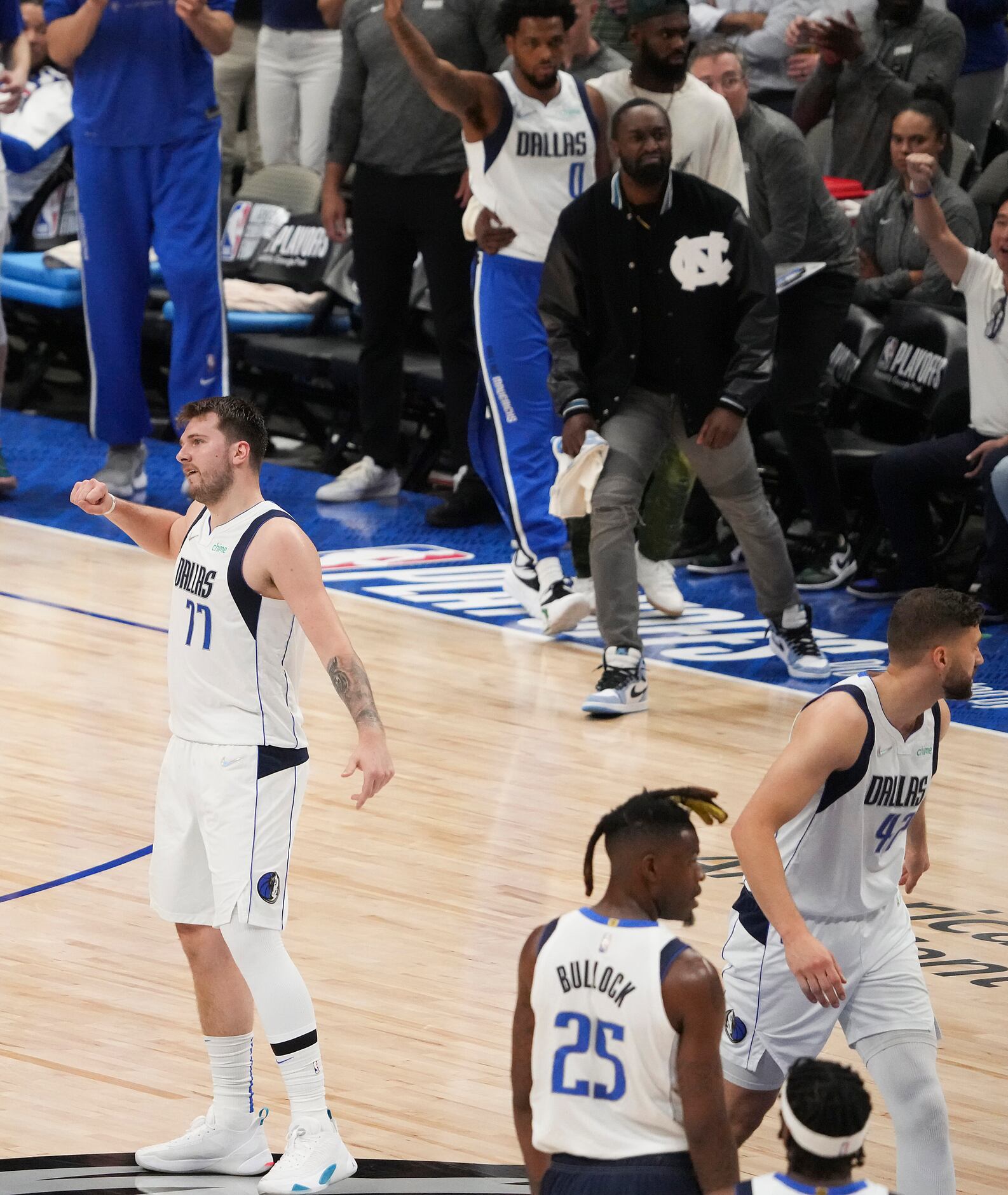 Dallas Mavericks guard Luka Doncic (77) celebrates after a basket during the third quarter...