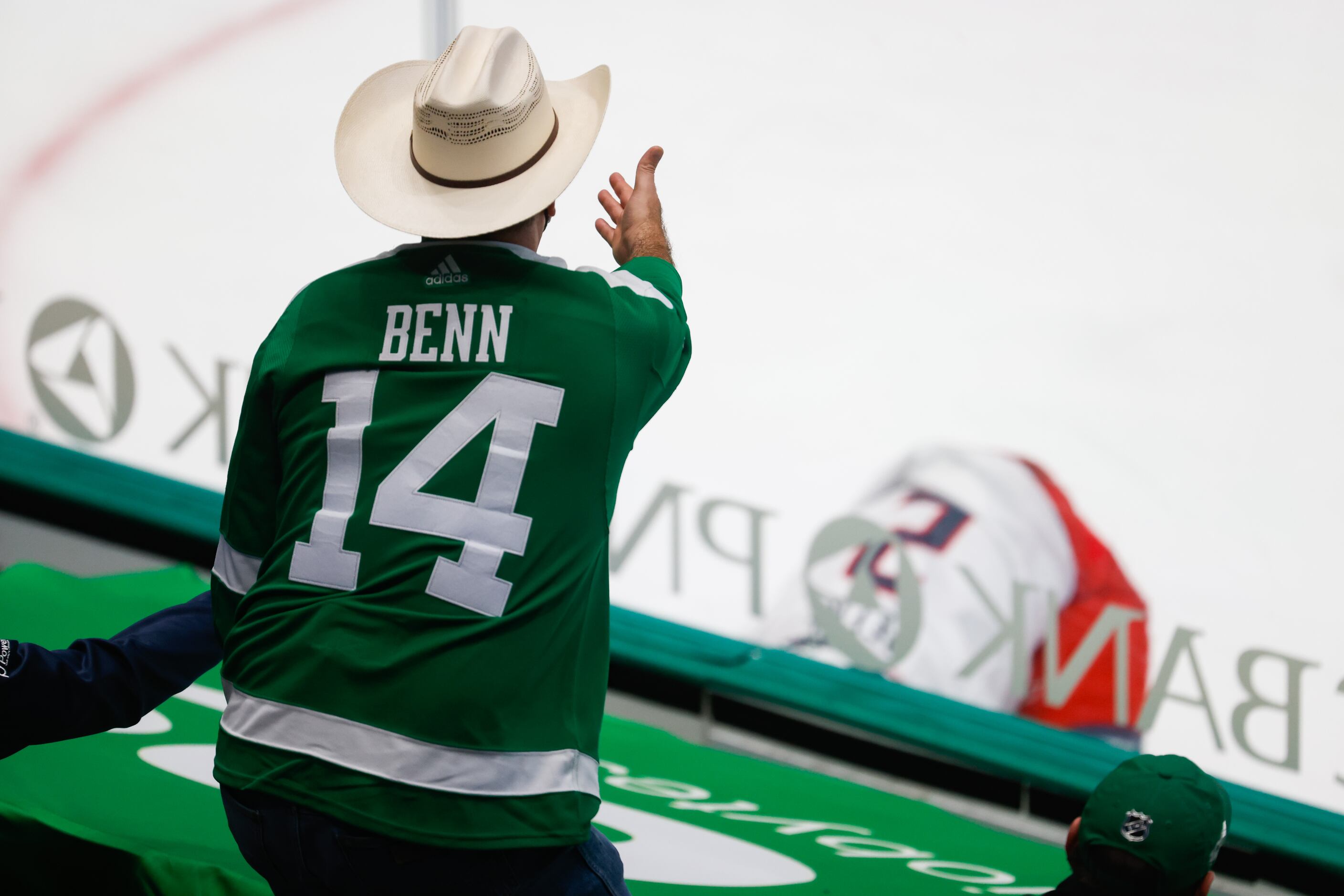 A Stars fan disapproves with a play in the second period of a game against the Columbus Blue...