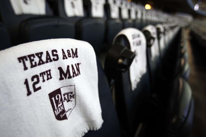 12th Man towels rest on seats inside Cowboys Stadium before the Cotton Bowl game between...