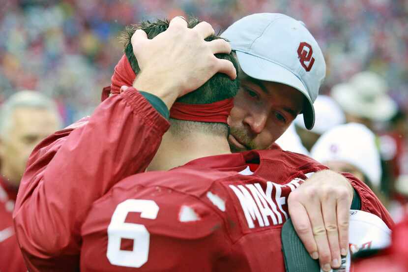 NORMAN, OK - DECEMBER 3: Lincoln Riley, offensive coordinator for the Oklahoma Sooners, hugs...