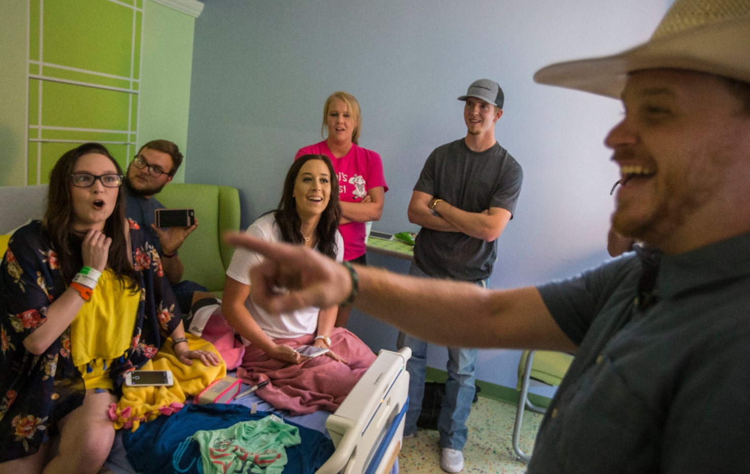 Singer-songwriter Cody Johnson, right, talks with Danielle Grey, left, and her family and...