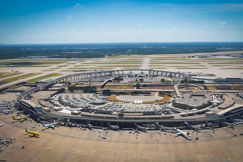 Terminal E (at bottom) and the Express South parking lot (top) at DFW Airport are seen on...