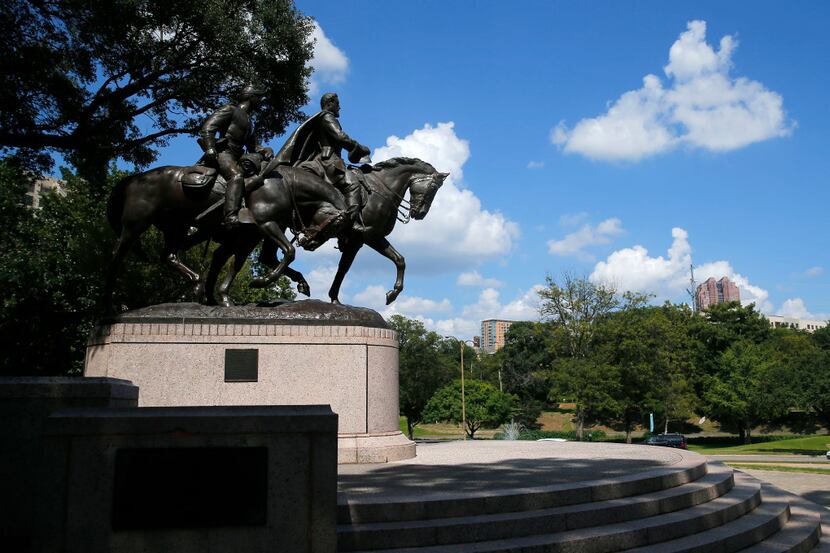 A statue honoring Robert E. Lee (right), with a soldier riding alongside him, in Robert E....
