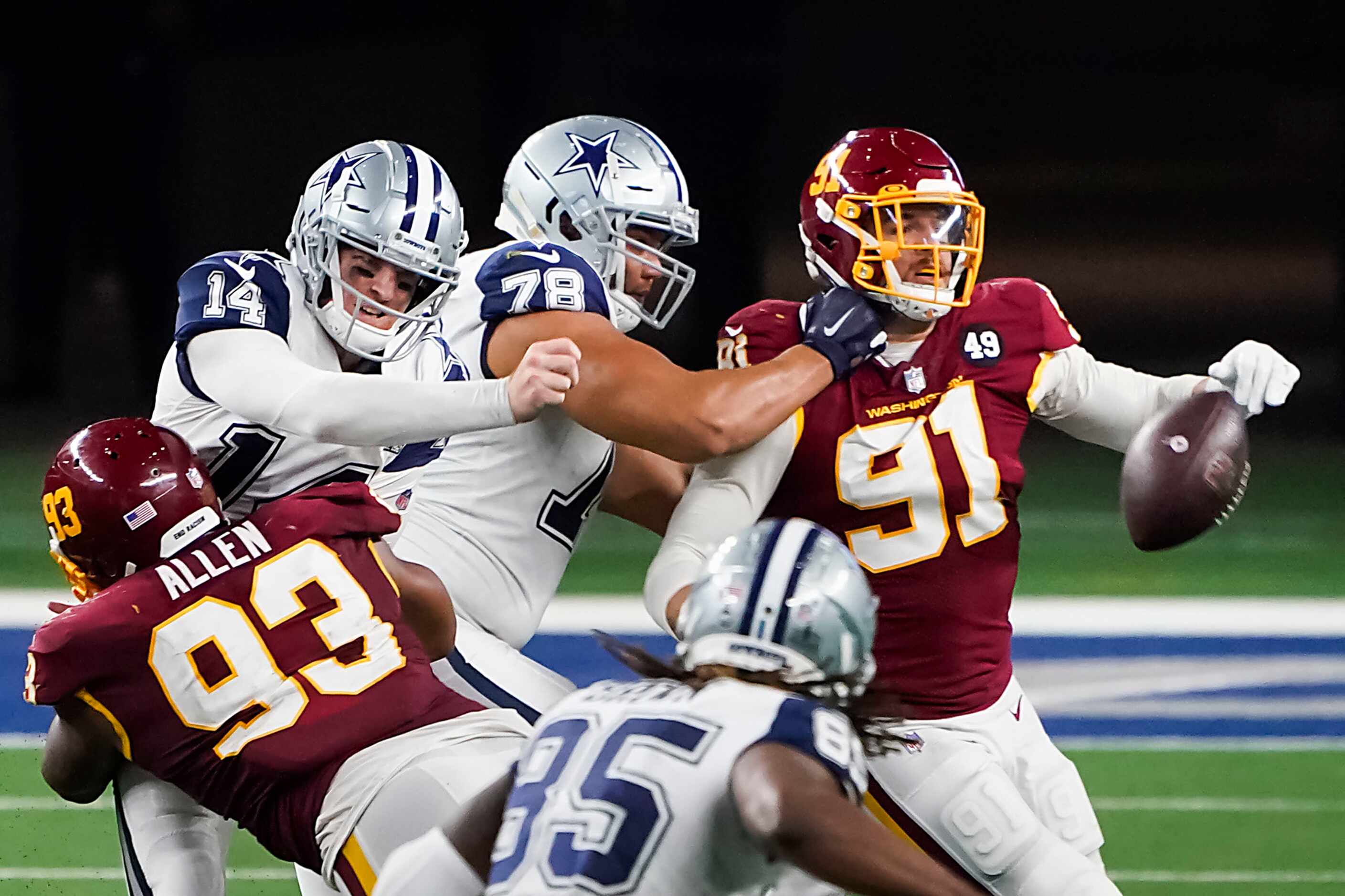 Dallas Cowboys quarterback Andy Dalton (14) is hit by Washington Football Team defensive...