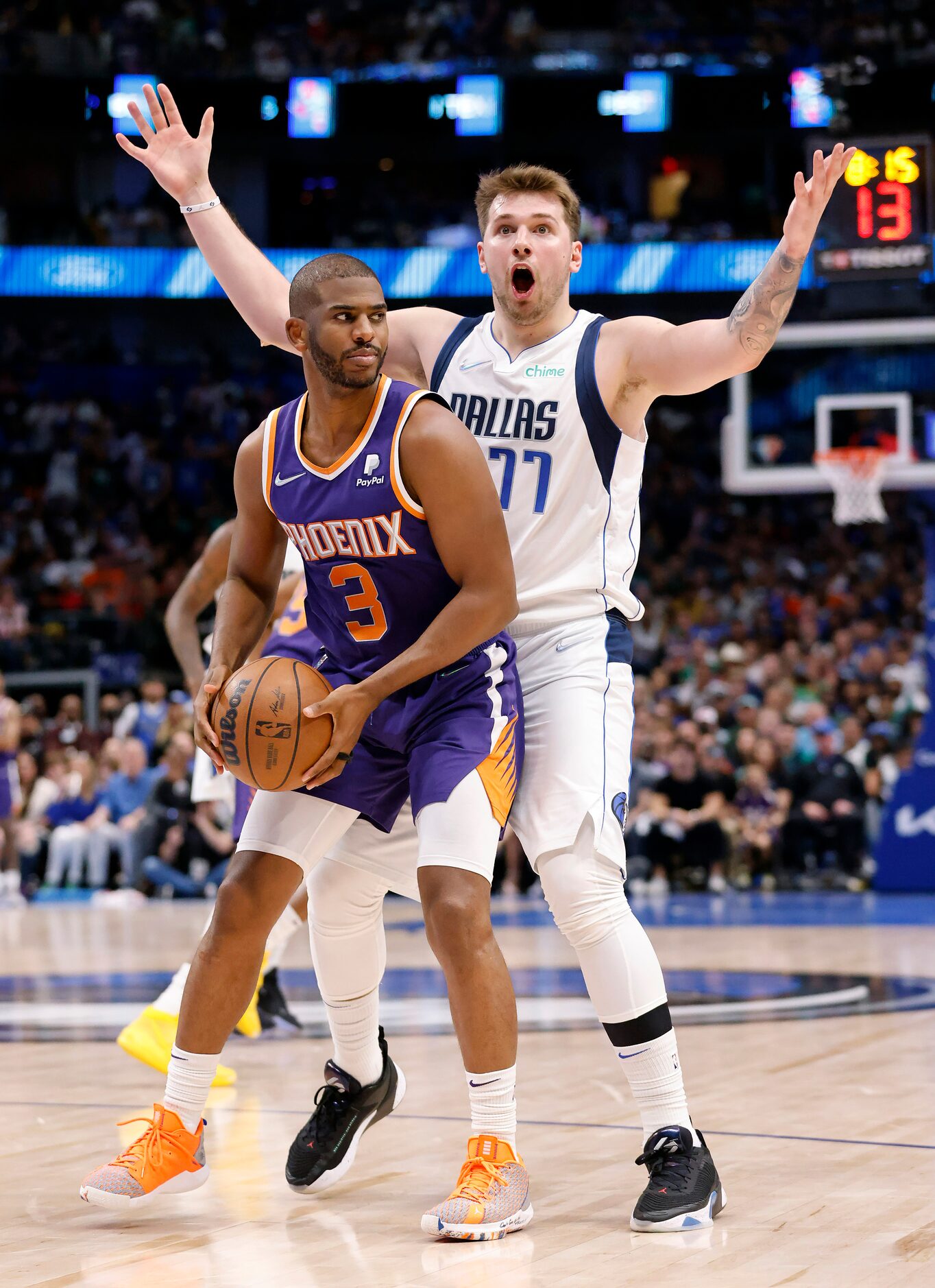 Dallas Mavericks guard Luka Doncic (77) has the ball stolen from him by Phoenix Suns guard...