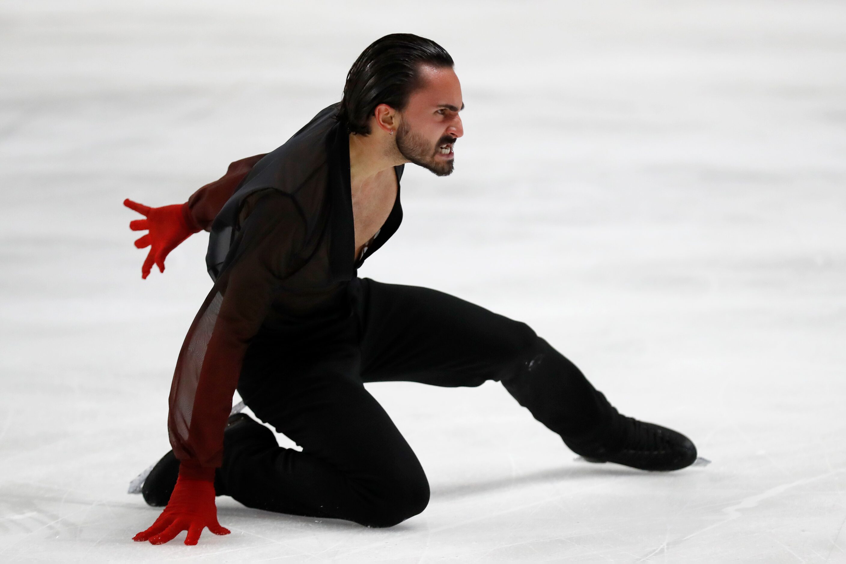 Kevin Aymoz, of France, competes in the men's free skate program during the Skate America...