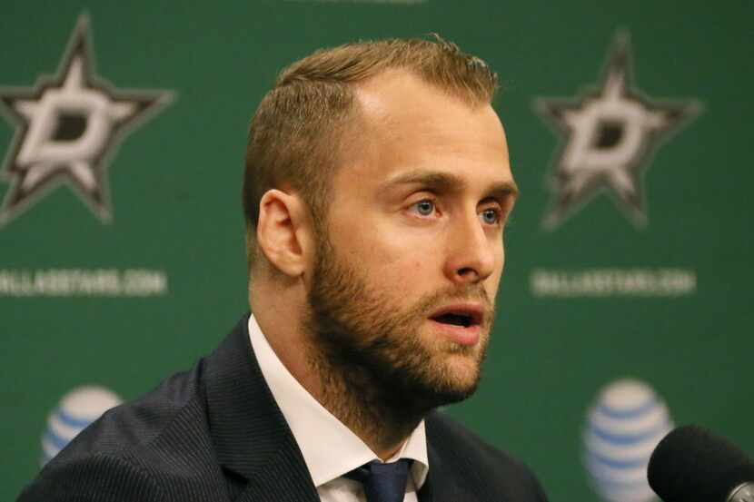 Dallas Stars' Rich Peverley talks with the media during a press conference before the...