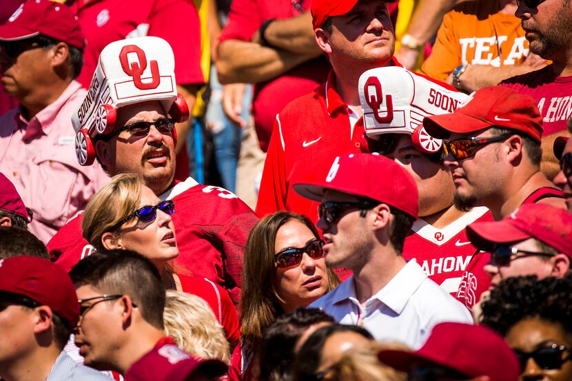 Oklahoma fans look up at the scoreboard during the fourth quarter of loss to Texas in the...