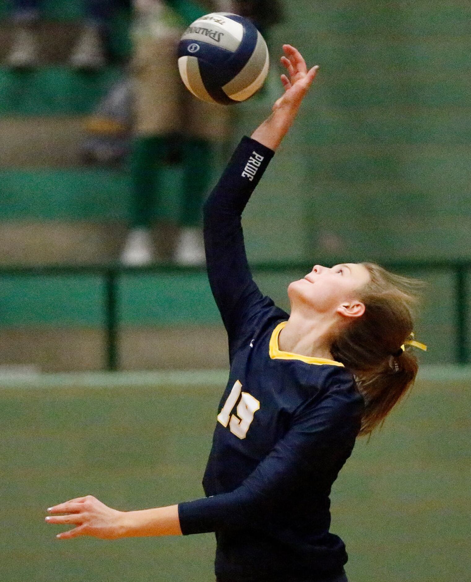 Highland Park High School outside hitter Emily Hellmuth (19) makes a hit during game two as...