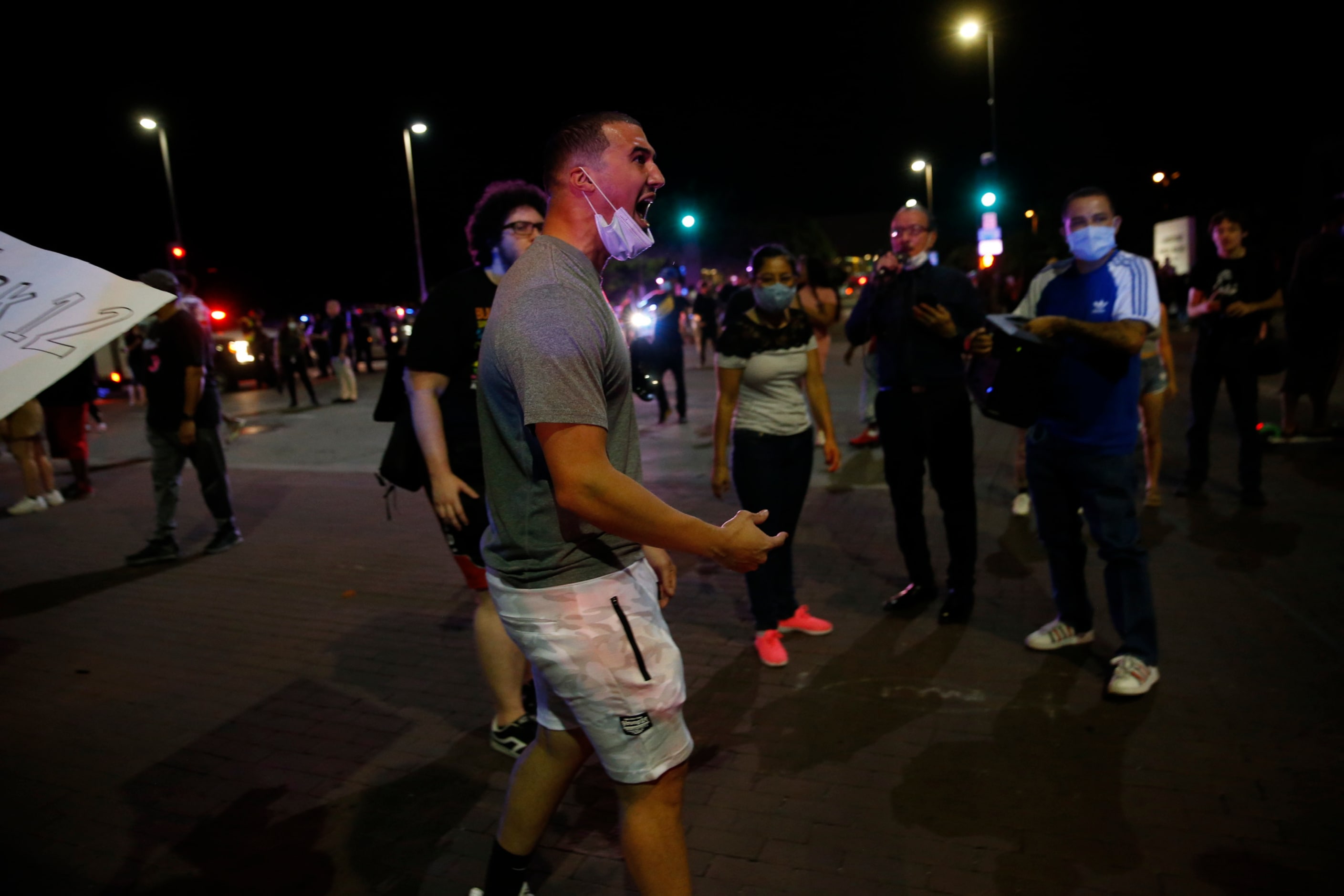 Protesters rally during a demonstration against police brutality in downtown Dallas, on...