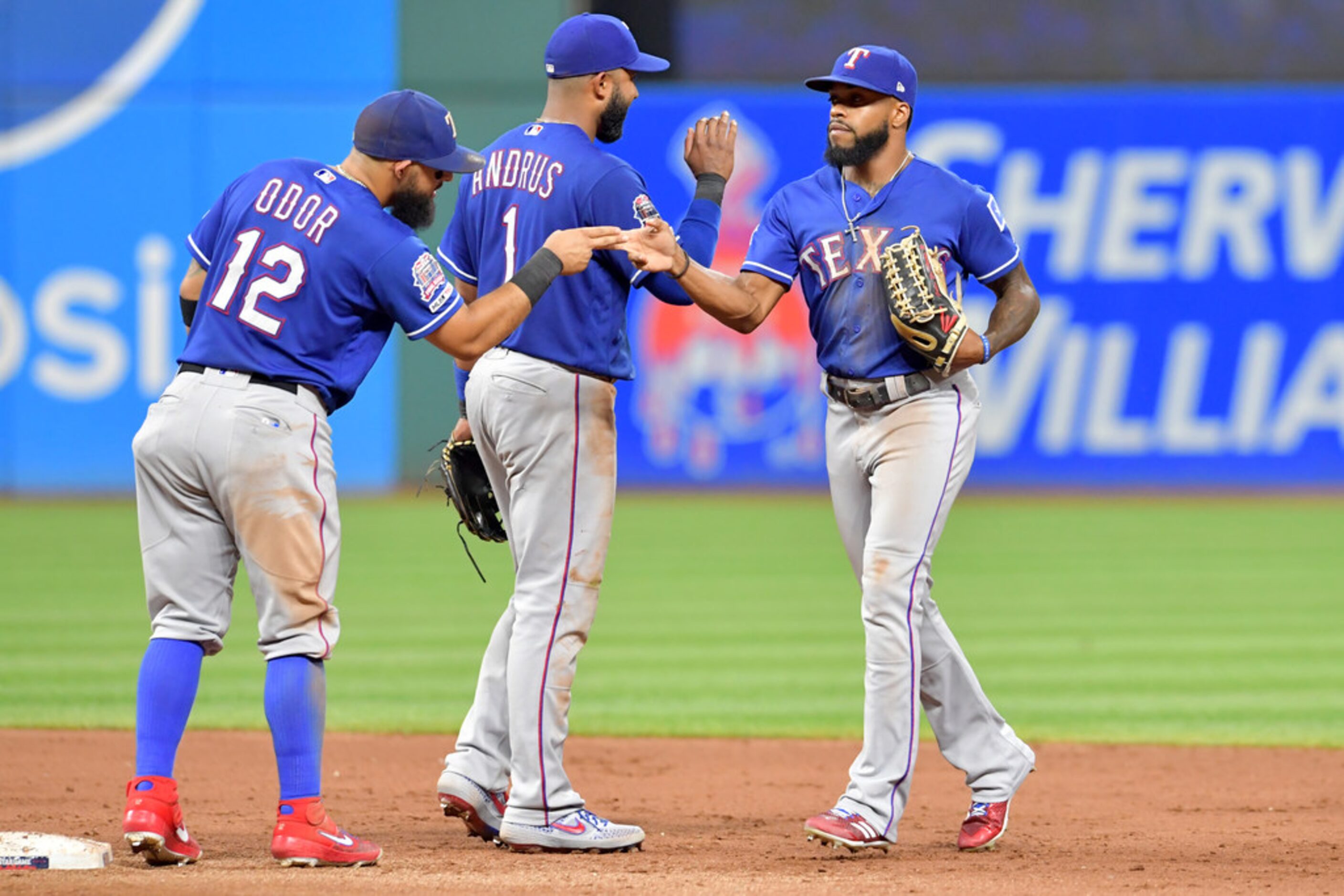 CLEVELAND, OHIO - AUGUST 05: Rougned Odor #12 and Elvis Andrus #1 celebrate with Delino...