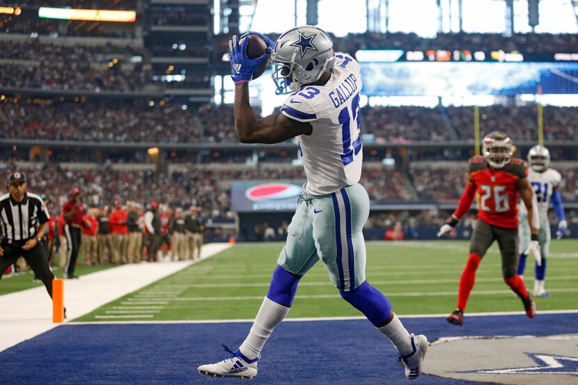 FILE - Cowboys wide receiver Michael Gallup (13) catches a touchdown as Tampa Bay Buccaneers...