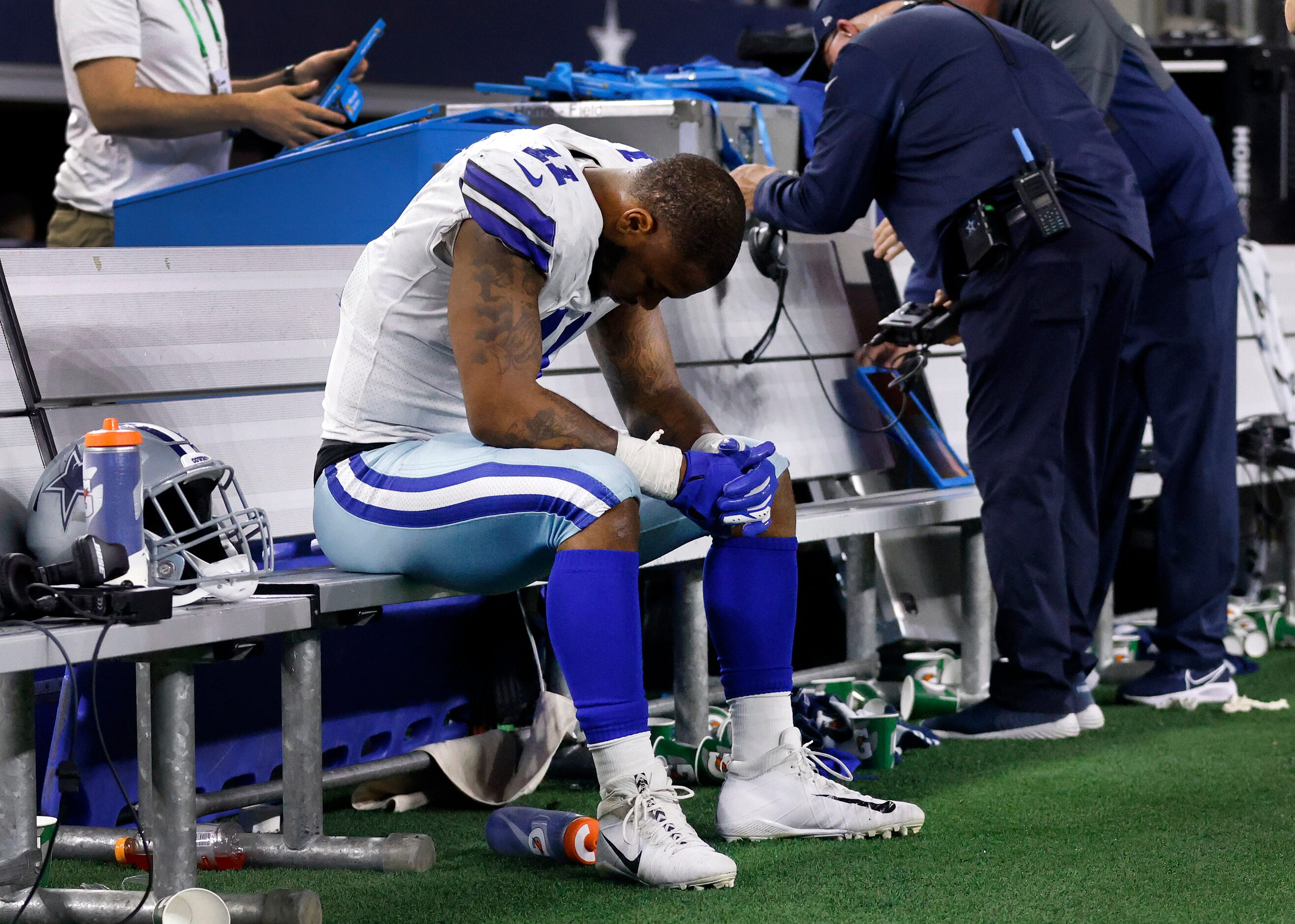 Dallas Cowboys outside linebacker Micah Parsons (11) sits alone on the bench after the...