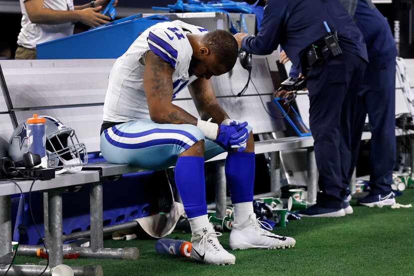 Dallas Cowboys outside linebacker Micah Parsons (11) sits alone on the bench after the...