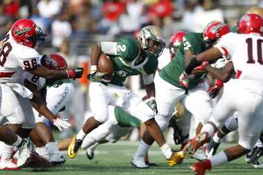 DeSoto running back Dontre Wilson (2) finds a hole in the Cedar Hill defense. Wilson ran for...
