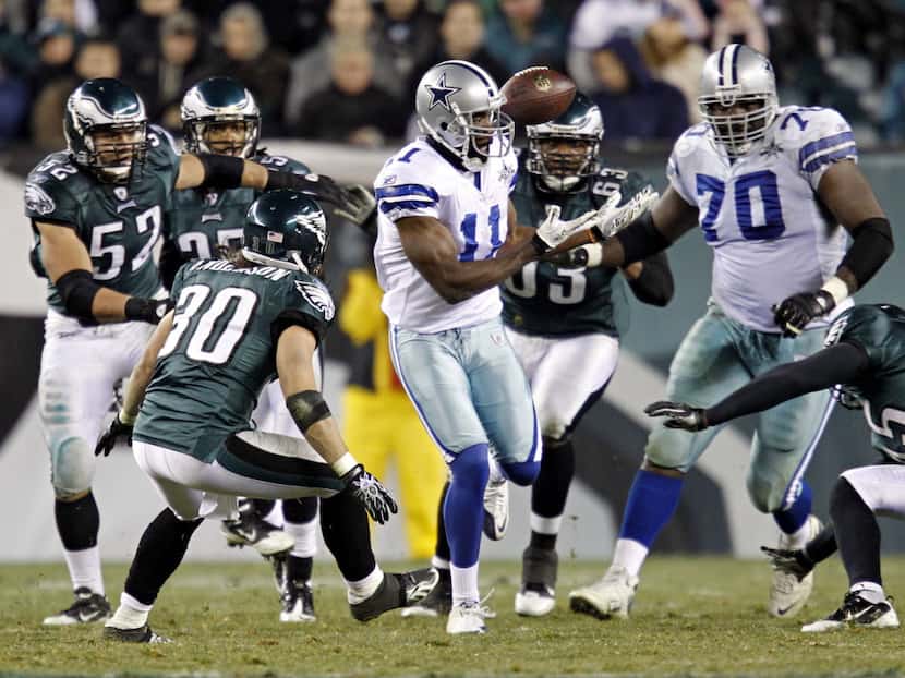 Dallas Cowboys wide receiver Roy Williams (11) bobbles a quarterback Stephen McGee pass...