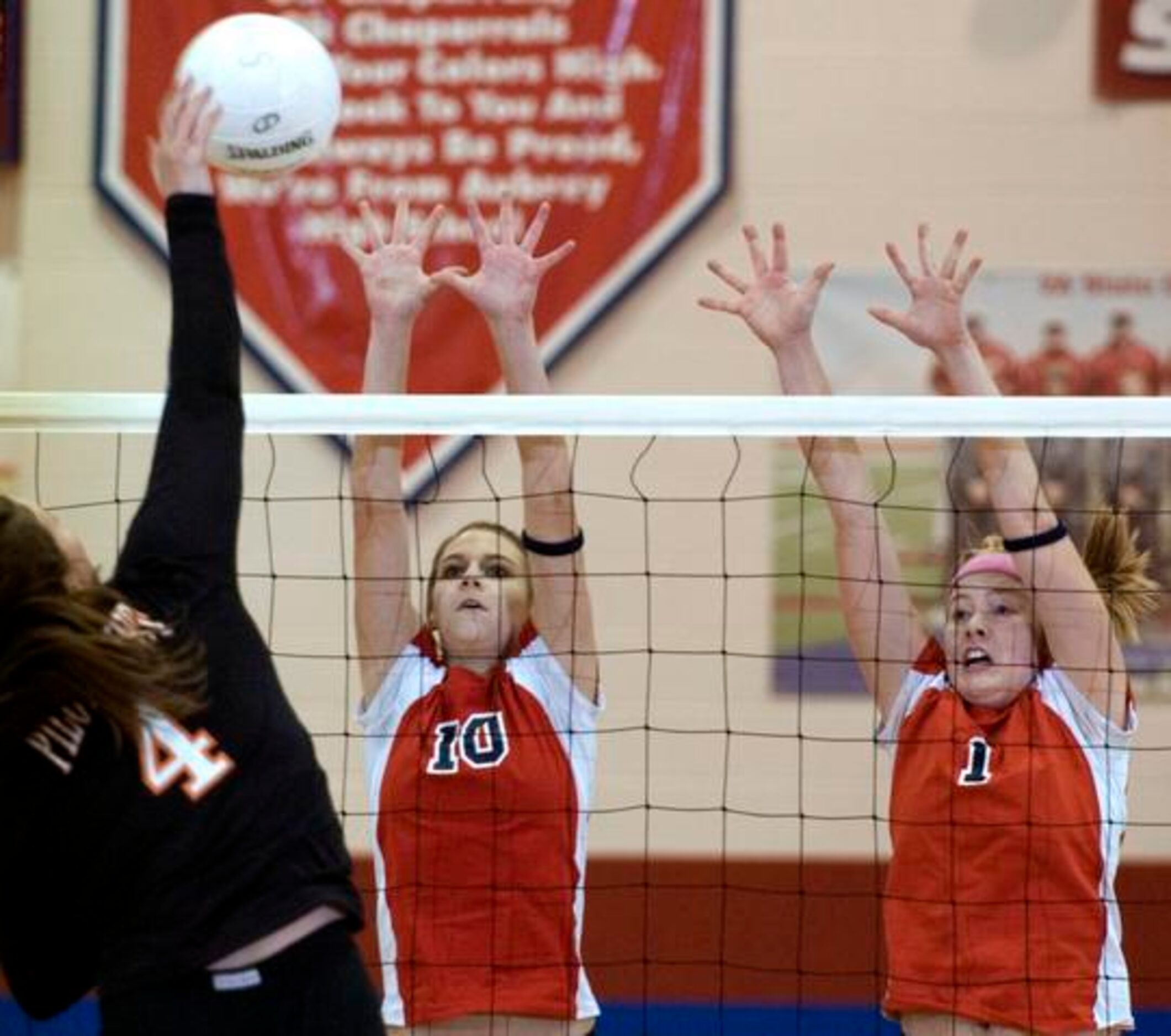 Aubrey's Jennifer Robbins (10) and Carrie Crooks (1) try to block a shot by Pilot Point's...