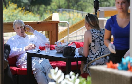 Henry Billingsley relaxes in the shade at the Shacks Dining & Dog Park at 5800 Windhaven...