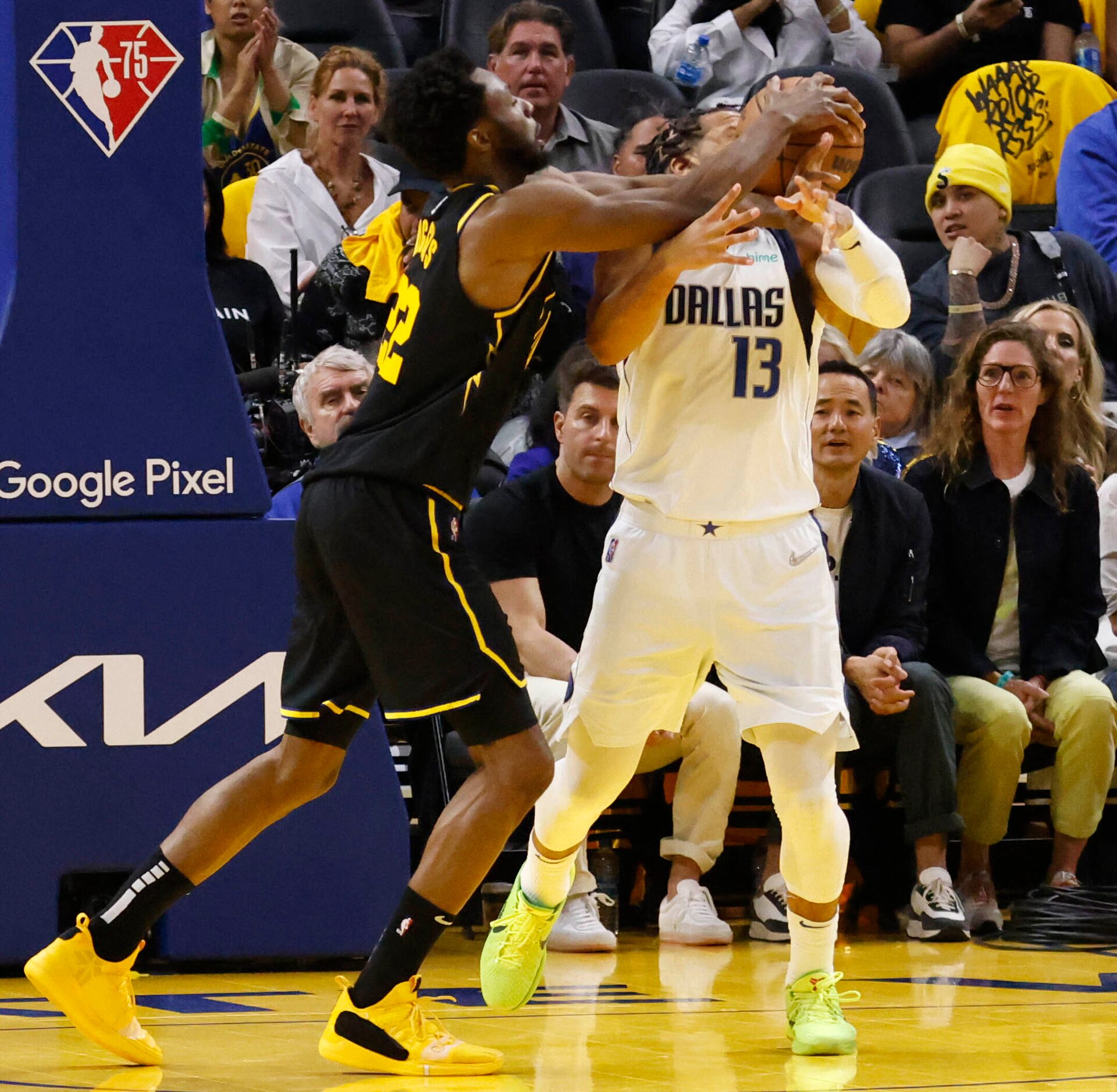 Golden State Warriors forward Andrew Wiggins (22) grabs the ball in front of Dallas...