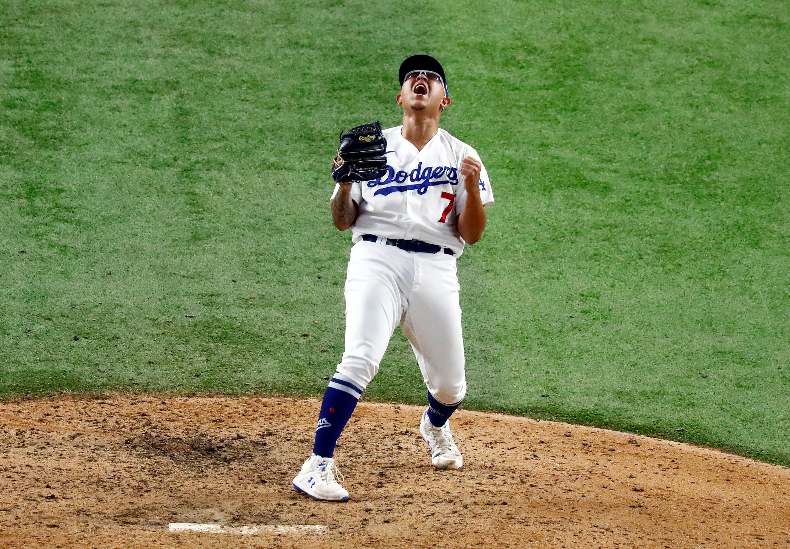 Los Angeles Dodgers relief pitcher Julio Urias (7) reacts after striking out Tampa Bay Rays...