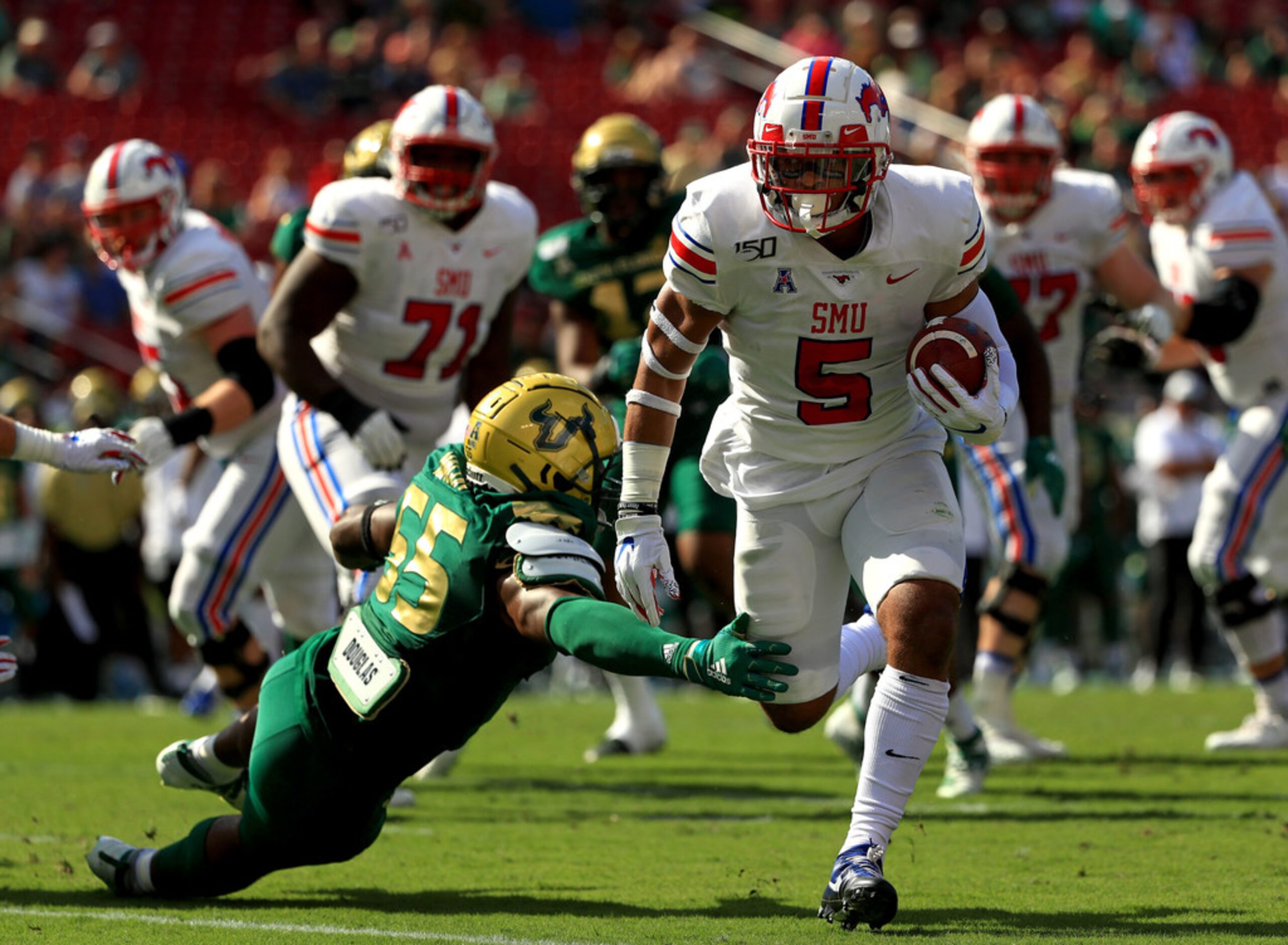 TAMPA, FLORIDA - SEPTEMBER 28: Xavier Jones #5 of the Southern Methodist Mustangs rushes...