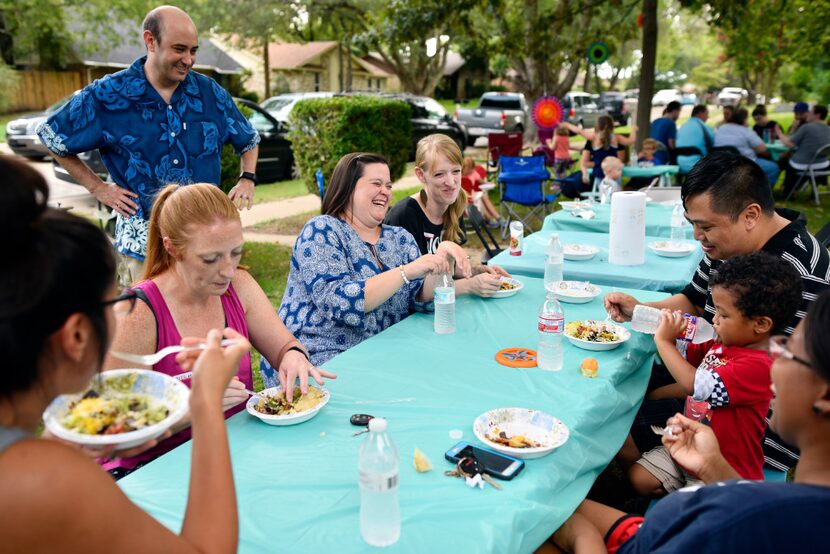 From left, Megan Raleigh, 37, Stephanie Wakeem, 41, and Laura Daulton, 36, mingle with other...