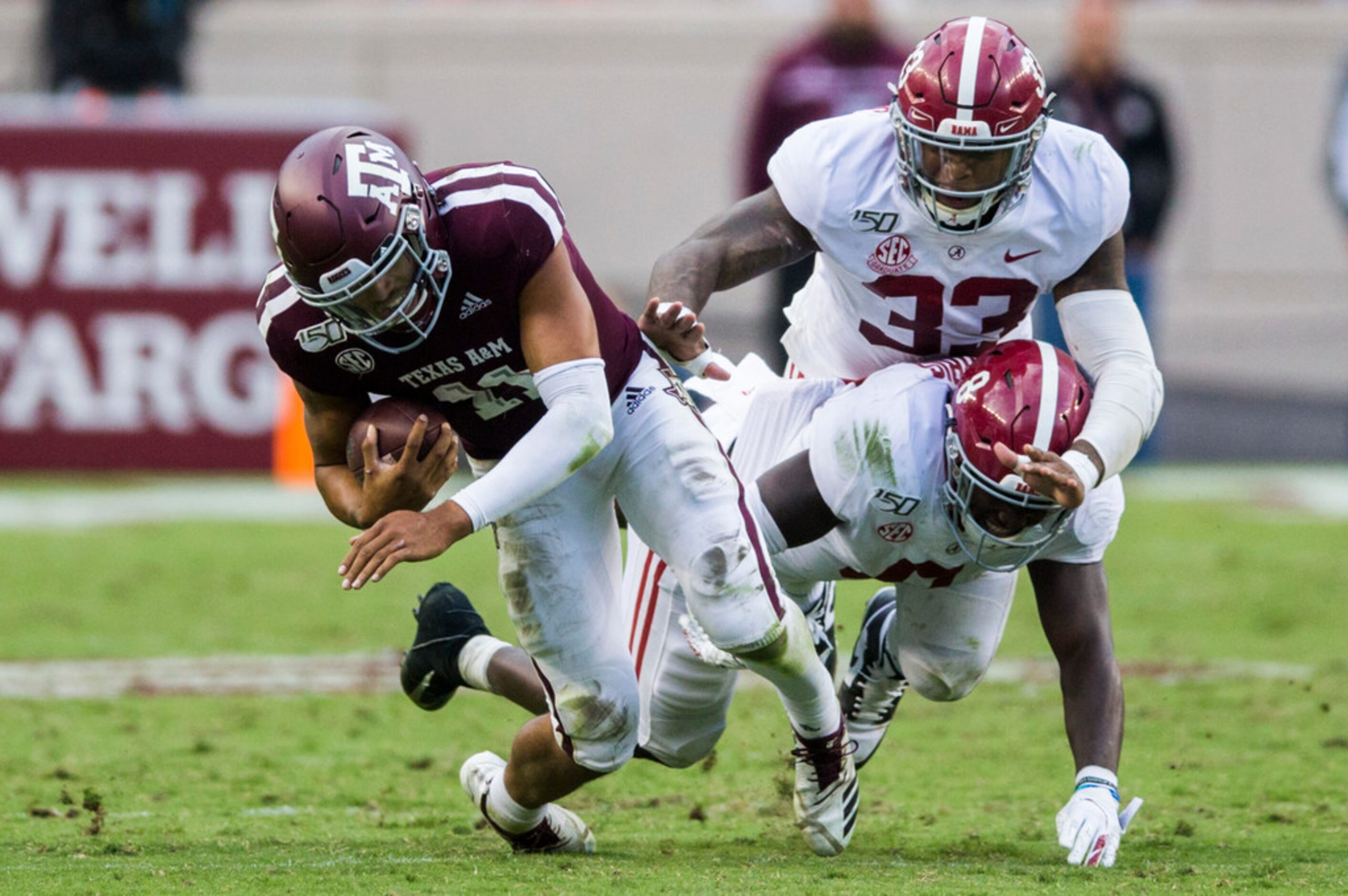 Texas A&M Aggies quarterback Kellen Mond (11) is tackled by Alabama Crimson Tide linebacker...