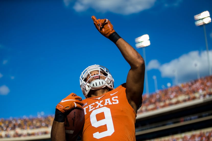 Texas Longhorns wide receiver Collin Johnson (9) celebrates in the end zone for a touchdown...