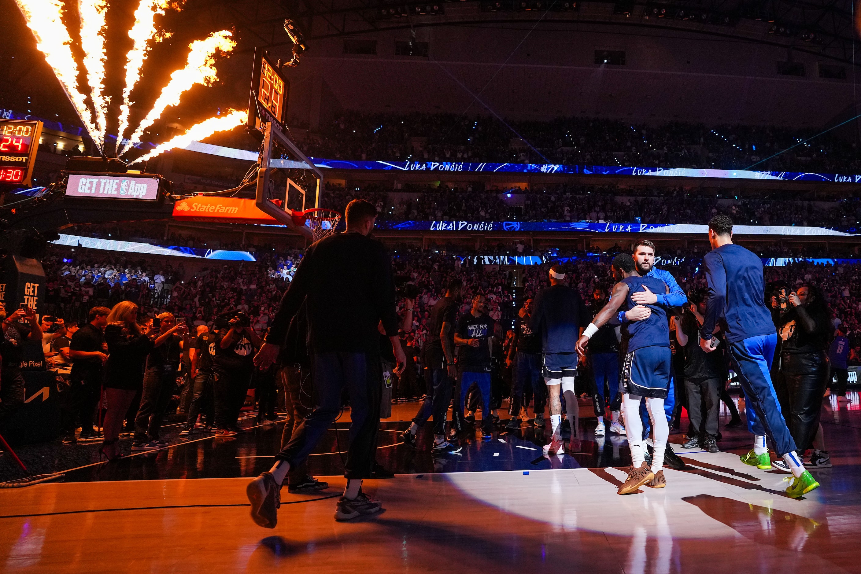 Dallas Mavericks guard Luka Doncic hugs guard Kyrie Irving as they are introduced before...