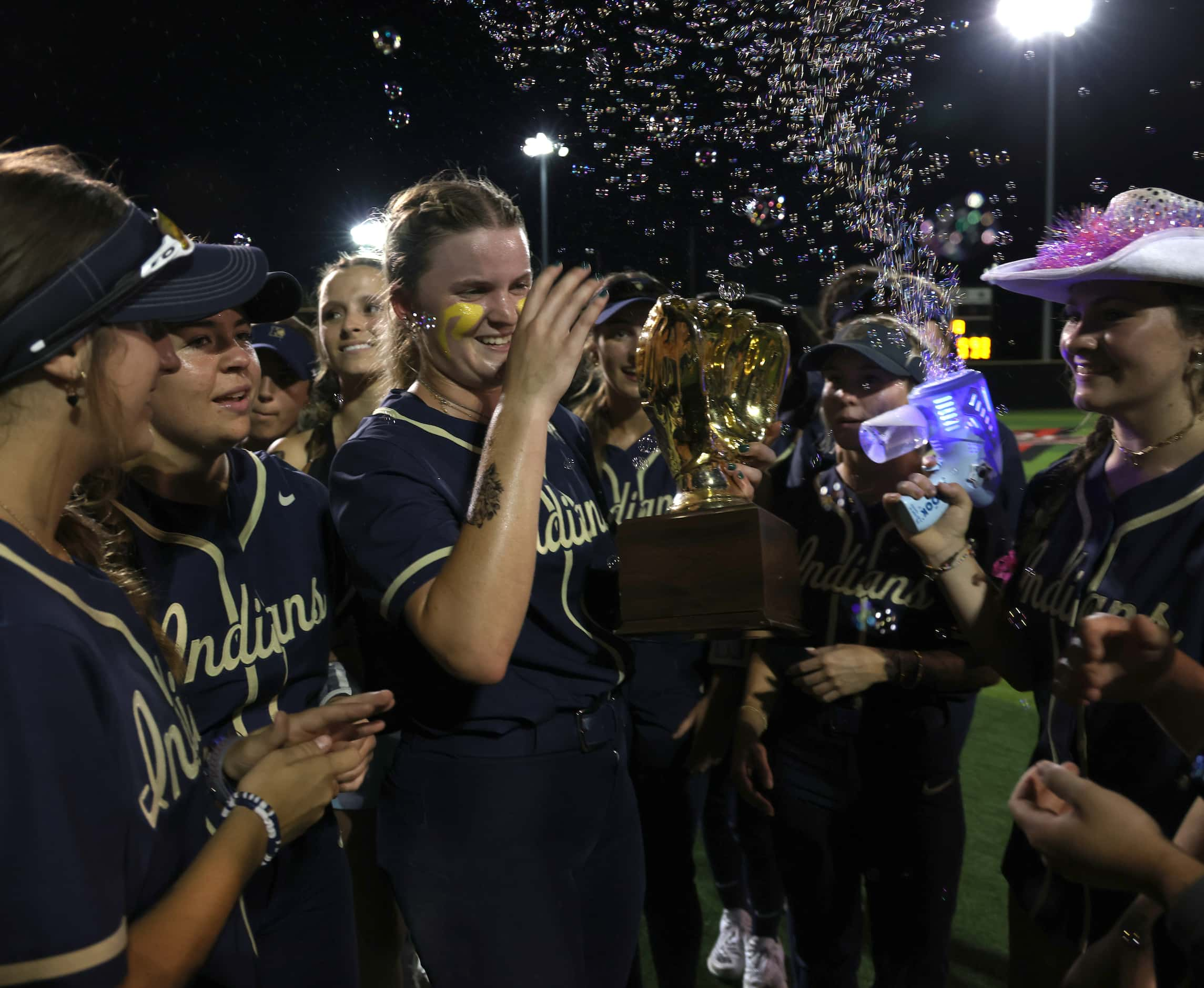 Keller players celebrate on the field following their 10-0 victory over Plano West in 6...