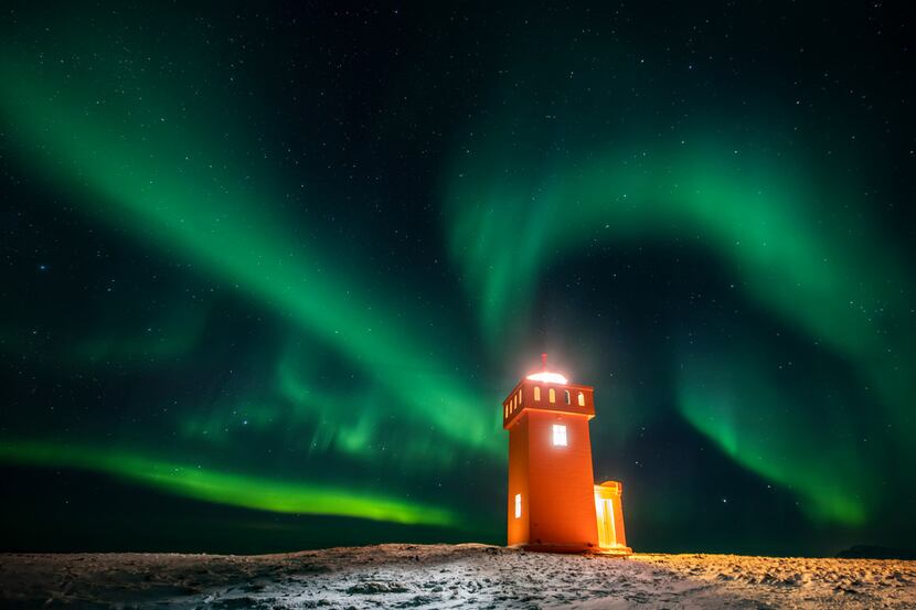 The northern lights were visible above a lighthouse in the village of Grundarfjorour,...