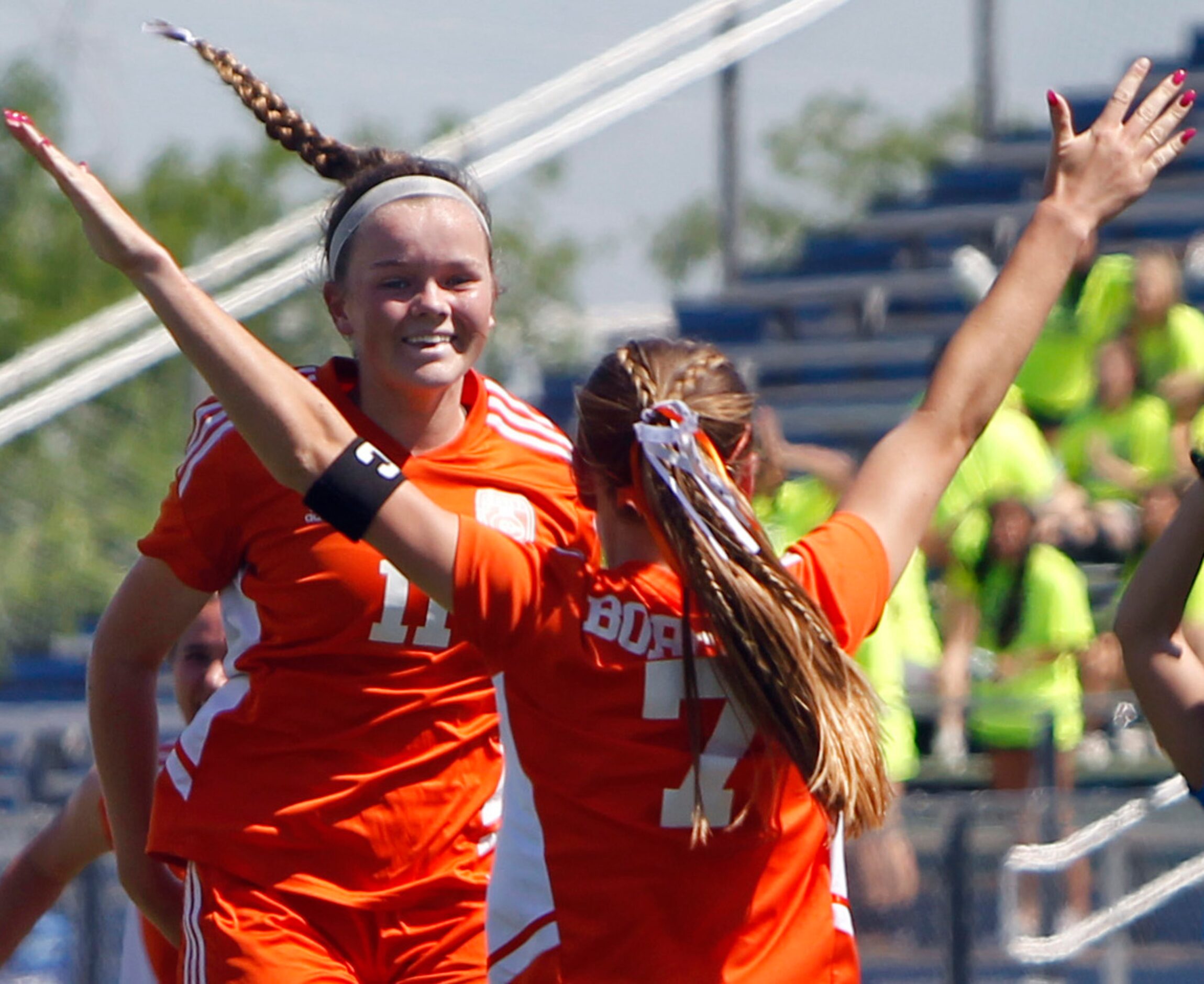 Celina's Madi Vana (11), left, leaps in celebration of teammate Lexi Tuite's (7) goal which...