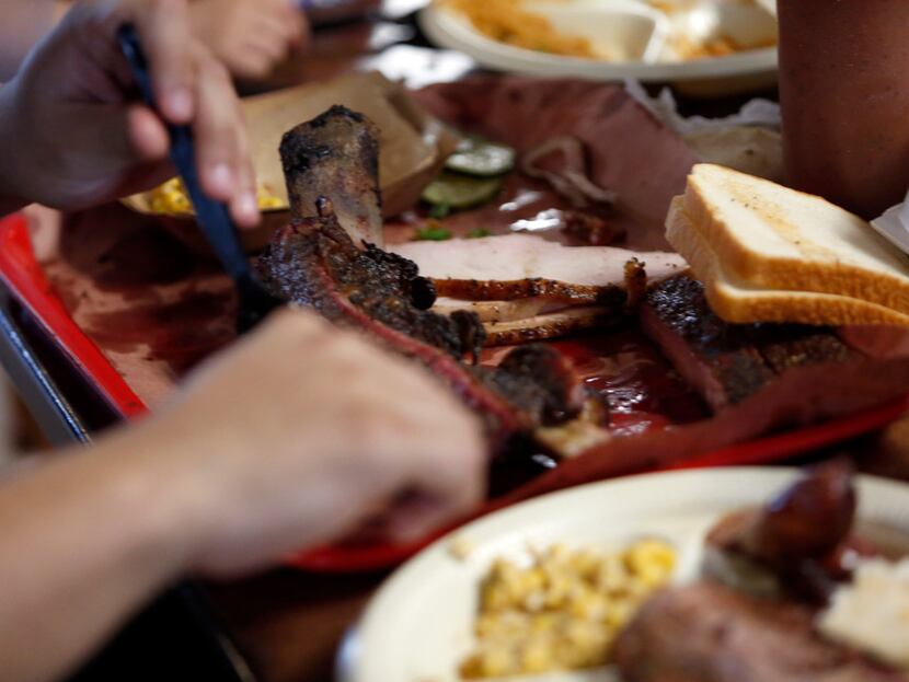 Smoked meats fill the plate on Feb. 2, 2019, on the final weekend before Flores Barbecue...