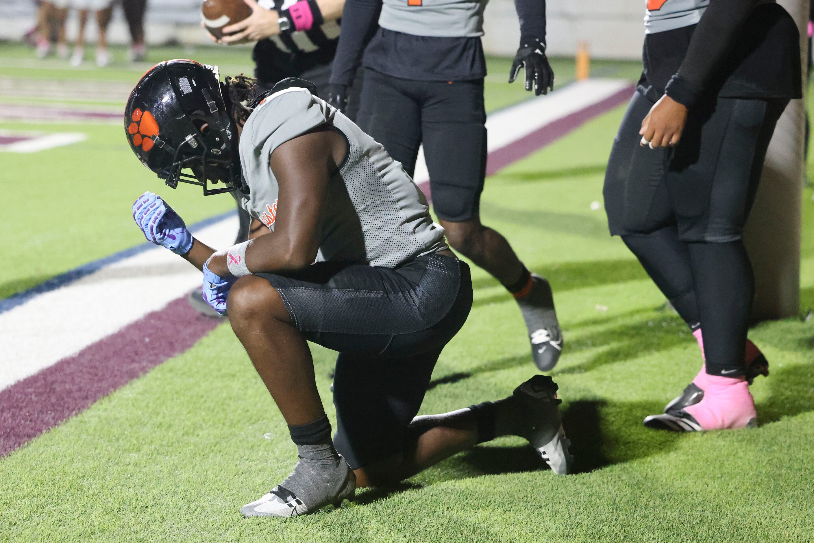 Lancaster High’s Dakeriean Johnson (7) bows as he scores a touchdown during the second half...