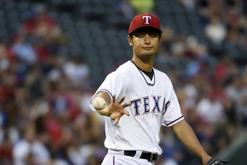 Texas Rangers starting pitcher Yu Darvish (11) reacts after after Oakland scored a run...