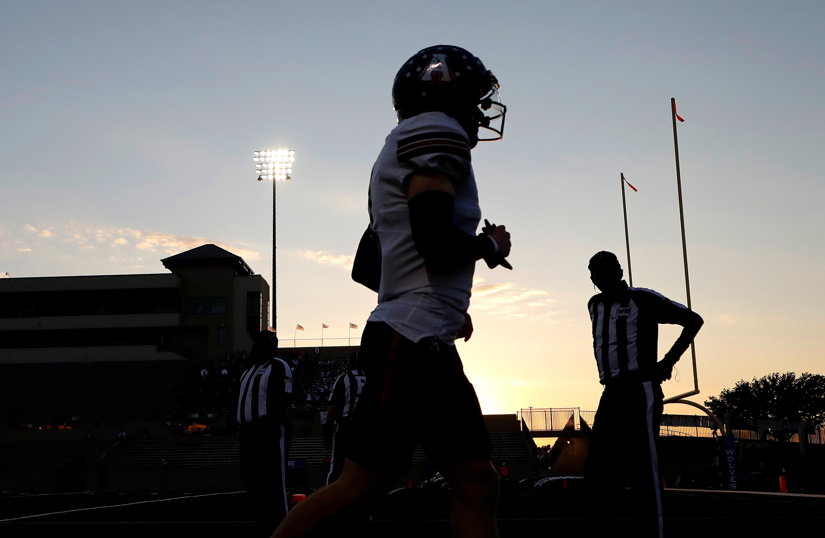 Allen High School heads to the locker room before kickoff as Plano West High School hosted...