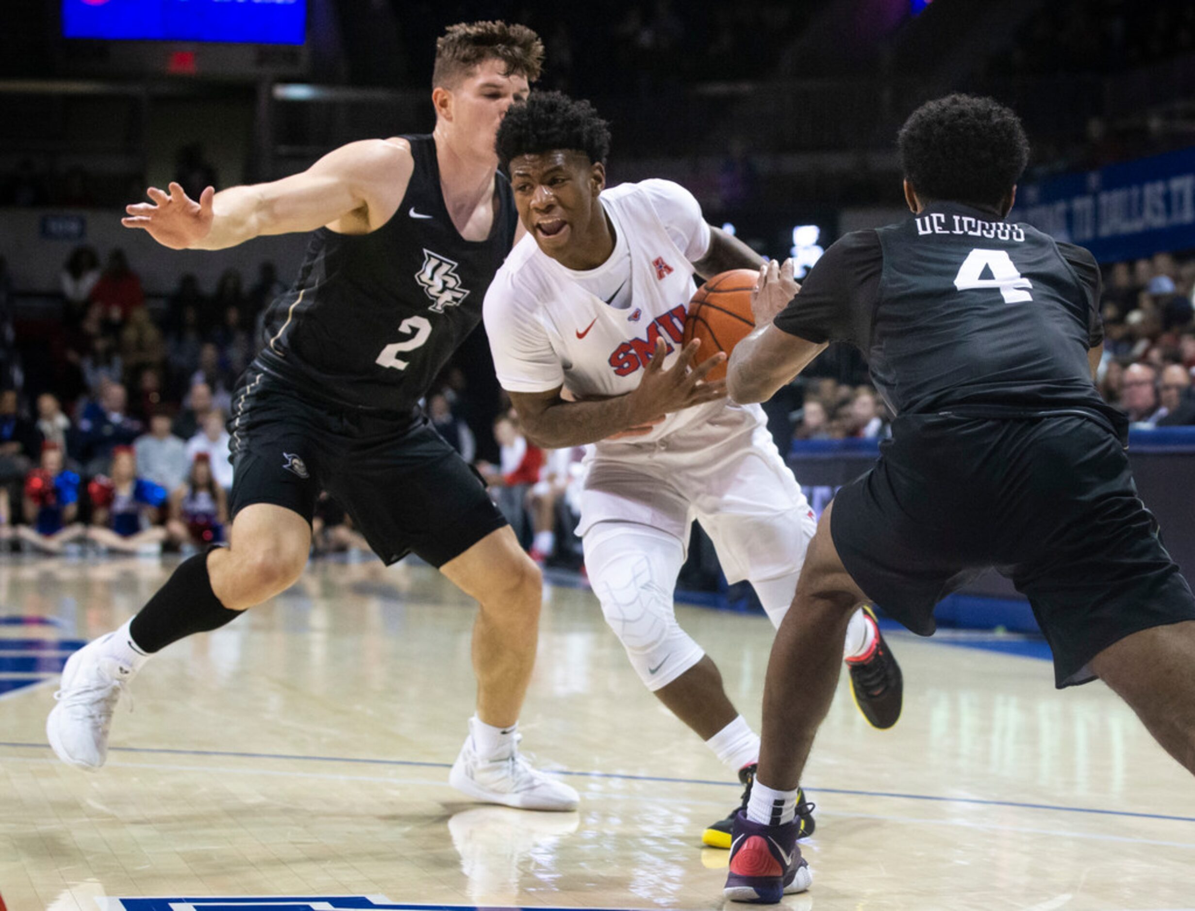 Southern Methodist Mustangs guard Kendric Davis (3) drives past UCF Knights guard Matt Milon...