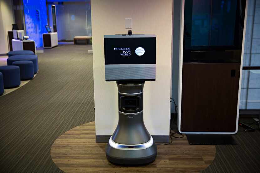 An iRobot Ava 500 teleconferencing unit stands inside the Technology Experience Center at...