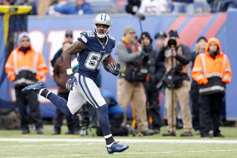 Dallas Cowboys wide receiver Dez Bryant (88) runs after the catch for a 50 yard touchdown...