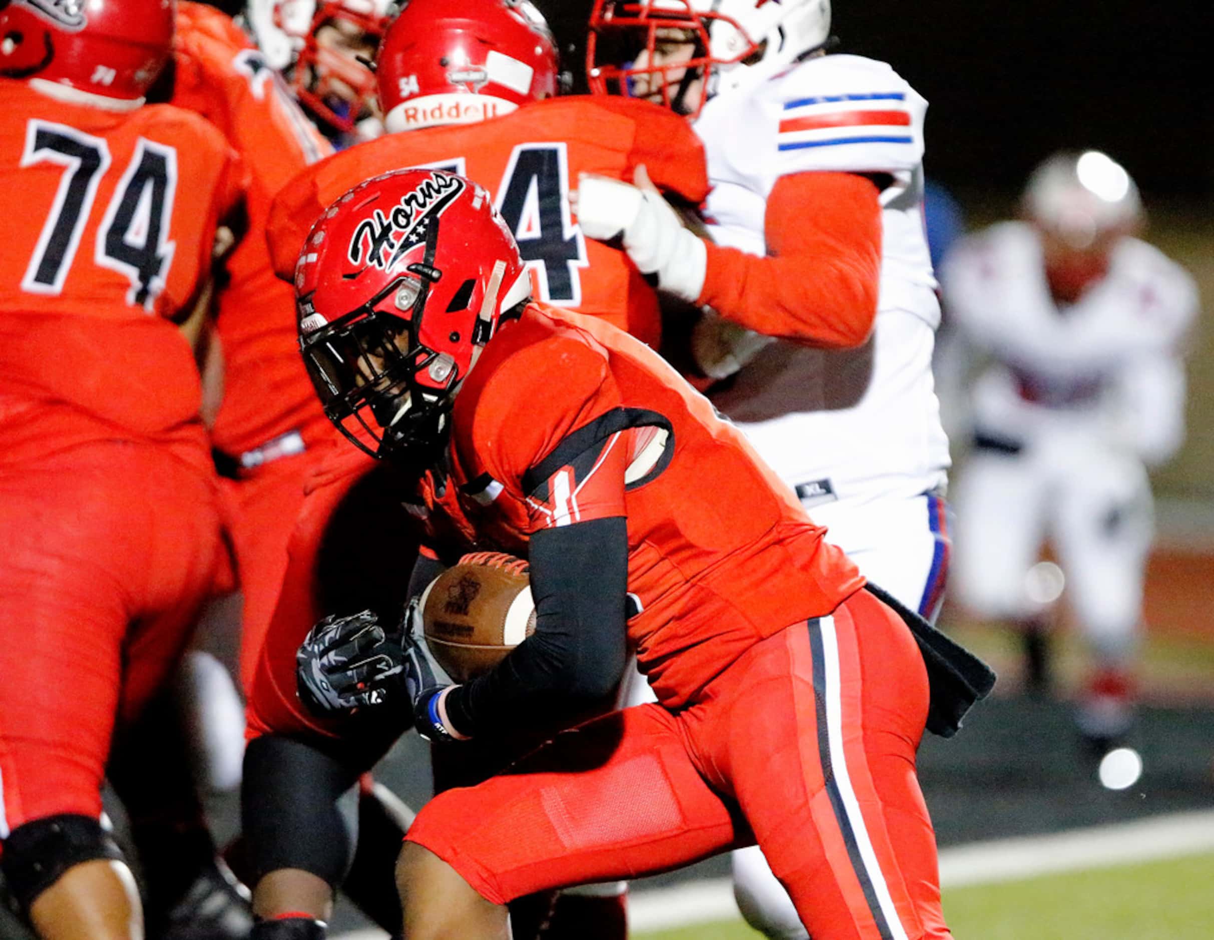 Cedar Hill High School running back Corie Allen (10) looks for the end zone on this...