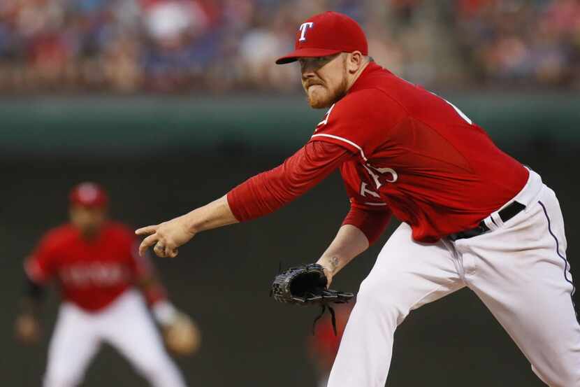 Texas starting pitcher Robbie Ross Jr. throws a third inning pitch during the Toronto Blue...
