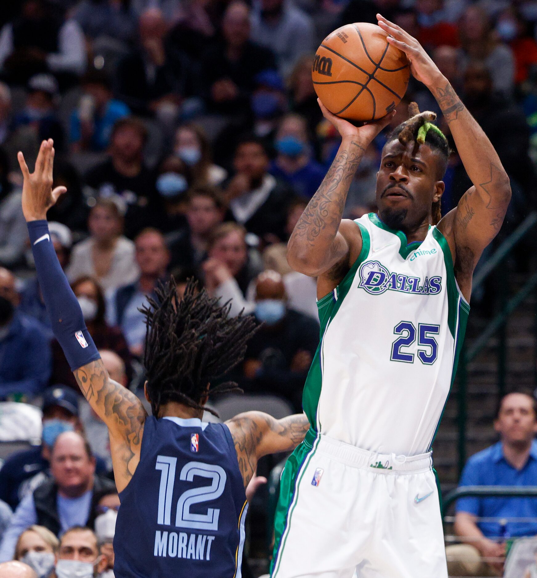 Dallas Mavericks forward Reggie Bullock (25) attempts a three-point shot over Memphis...