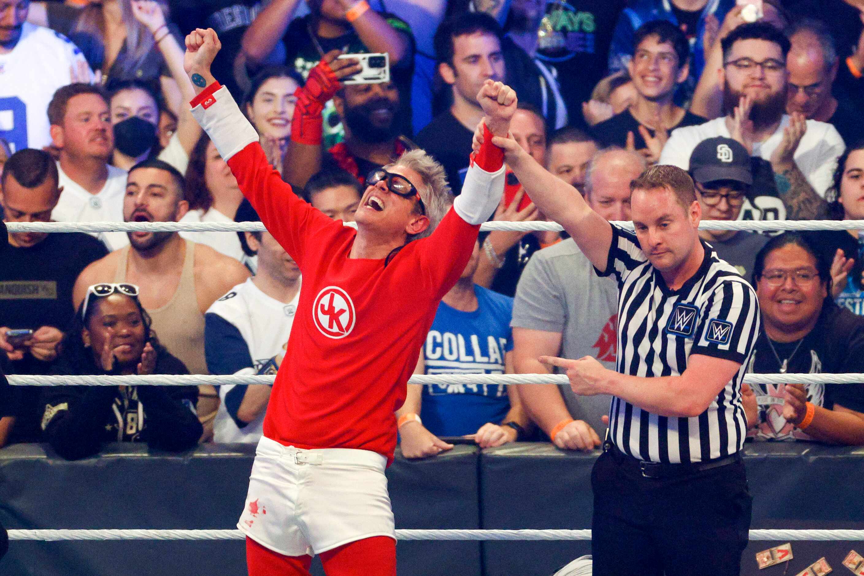 Johnny Knoxville raises his arms in victory after a match against Sami Zayn at WrestleMania...