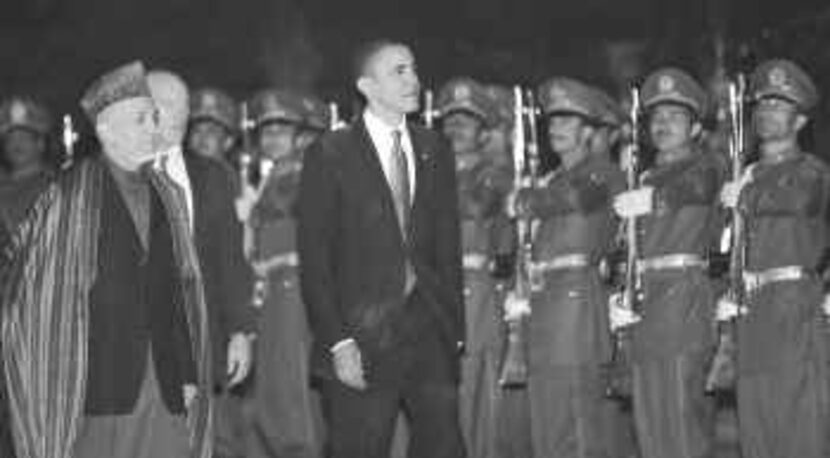 President Barack Obama reviewed the honor guard with Afghan President Hamid Karzai in Kabul...