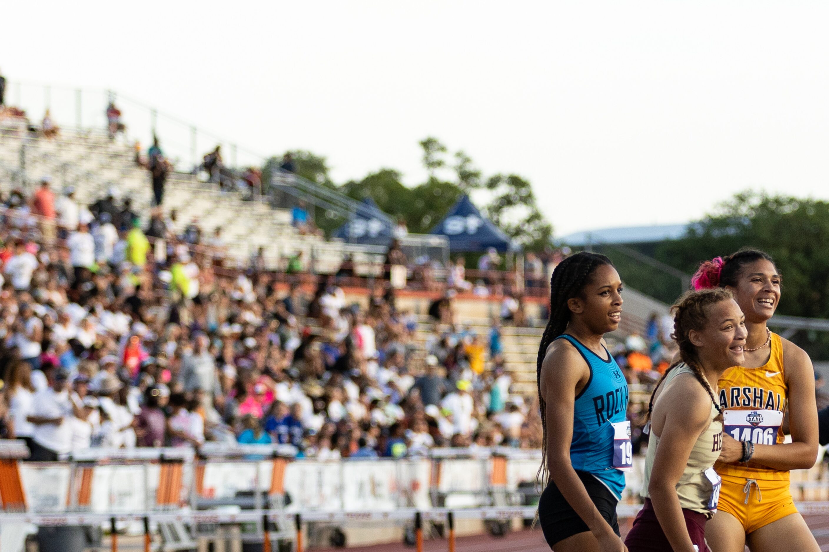 Frisco Heritage’s Kirin Chacchia, center, reacts after winning the girls’ 300m hurdles at...